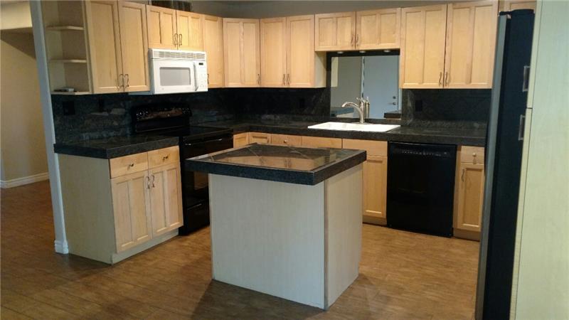 Kitchen with Alder cabinets & island
