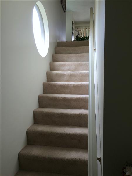 2 circular stairway windows for great light