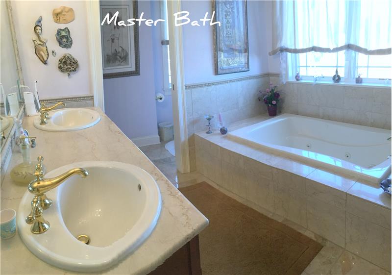 Master bath en suite with walk in closets