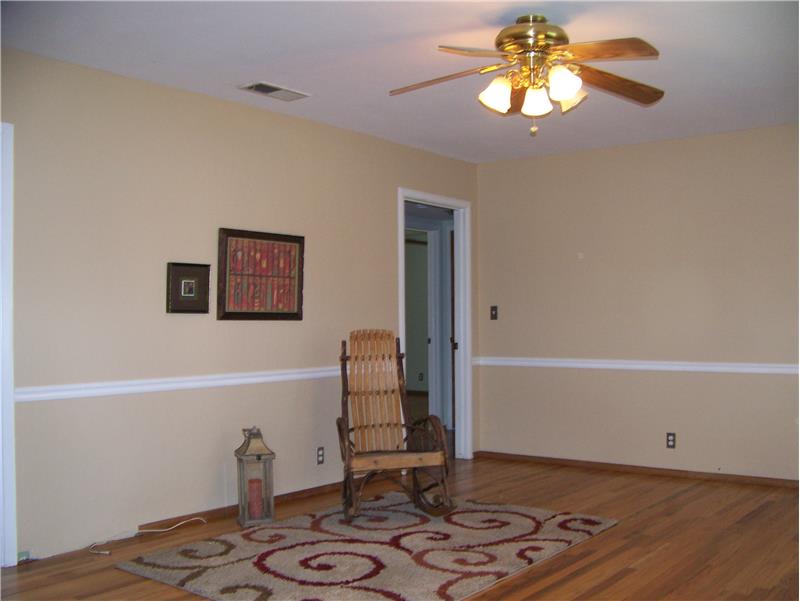 Living room featuring newly refinished hardwood floors.