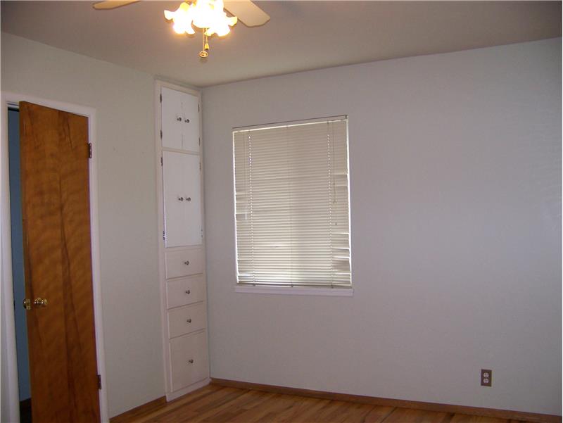 Bedroom with closet and built-in cabinet