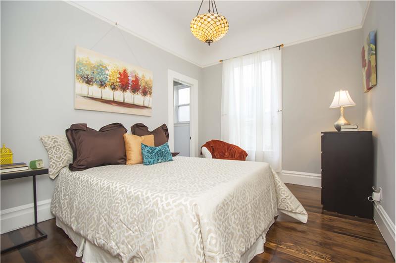 The large bedroom is bright and airy and underscored by a well-sized walk in closet with ample storage.