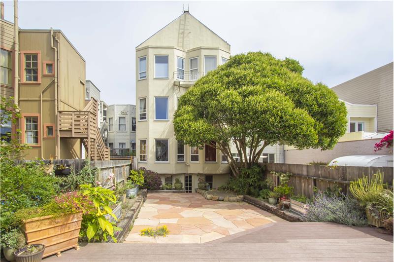 The outdoor space features a picnic bench and two grills (one meat, one veggie), this space allows residents to relax away from 