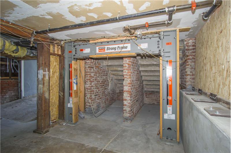 Downstairs you’ll find a laundry room shared with 2 other units and a parking area within the garage that can fit two motorcycle