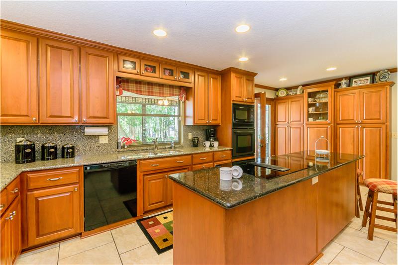 Island Kitchen with double ovens and gorgeous cabinetry