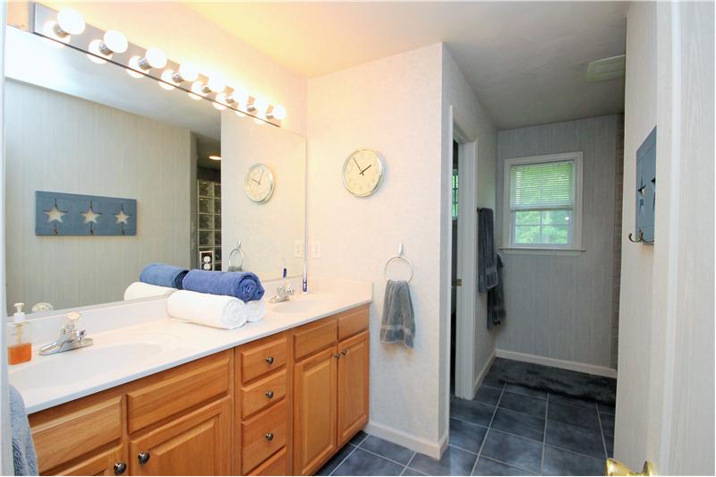 Master suite with walk in shower and dual sinks