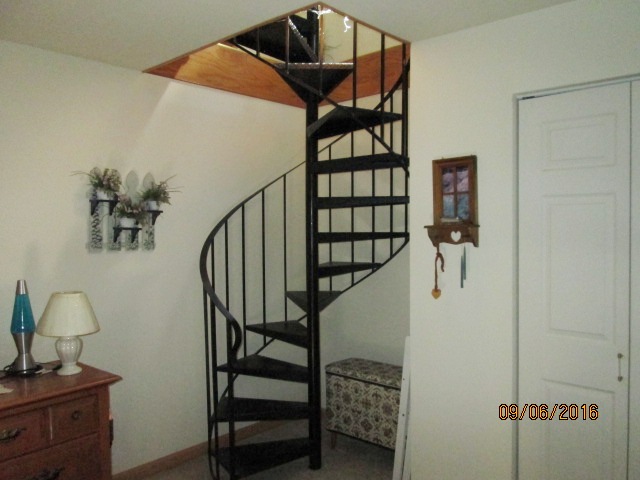 Spiral staircase to master bedroom