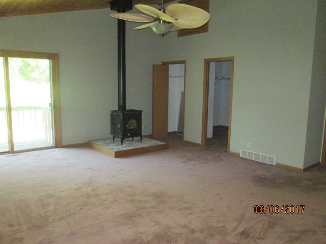Master bedroom with wood burning stove