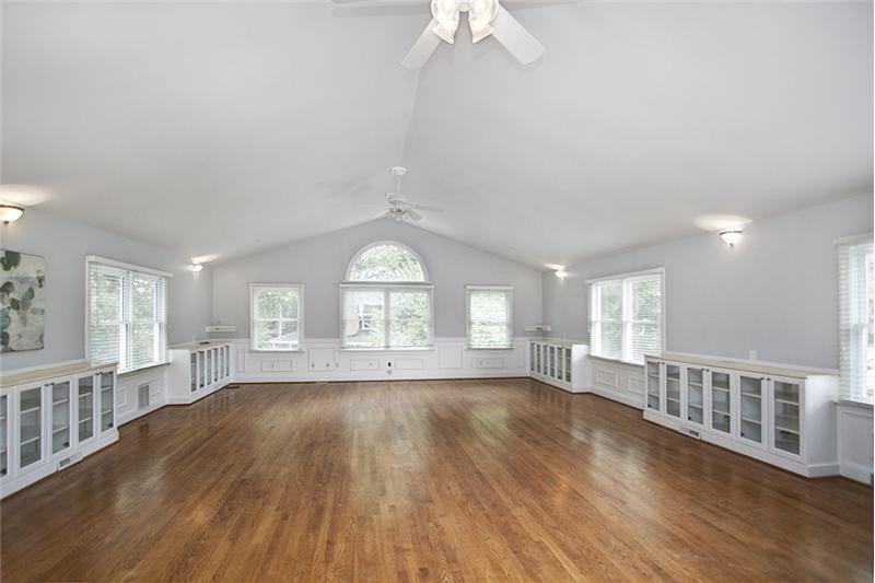 Huge living space (approximately 800 SF) above the garage with plenty of built-ins