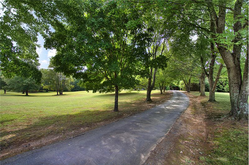 The tree-lined driveway allows you to truly enjoy coming home!