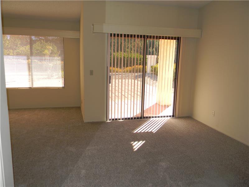 The master bedroom has a large space for an office or sitting area