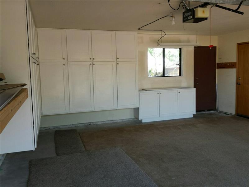 Look at all the custom cabinets in the garage!