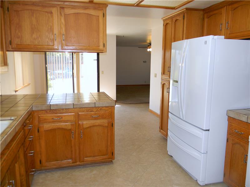 This awesome refrigerator stays with the home. Look at all the cupboard space!