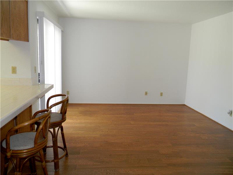 Beautiful real wood floors in the family room off the kitchen