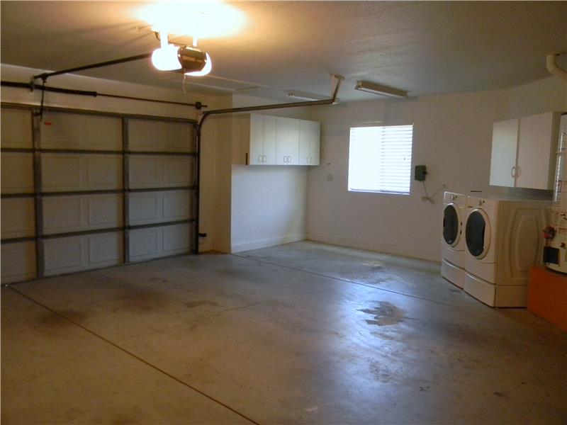 Room for the golf cart and yes, the front loading washer & dryer stay with the house