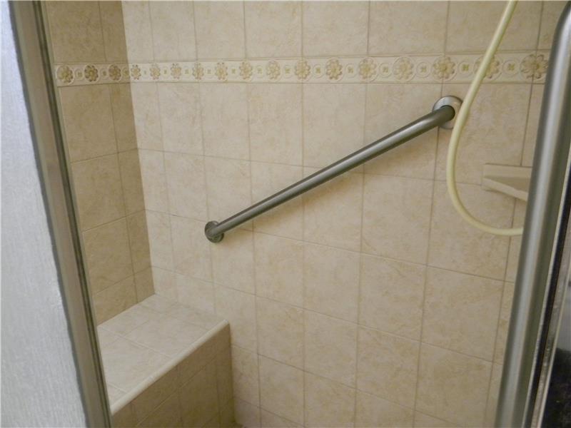 The shower has been upgraded with tile