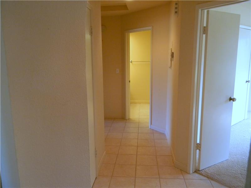 Hallway has beautiful tile floors