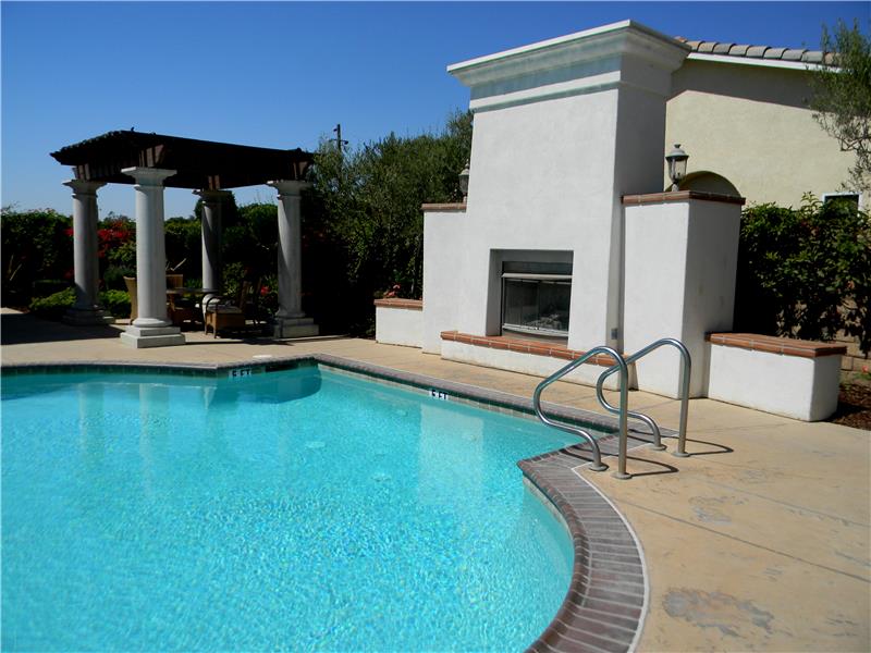 Pool with outdoor fireplace
