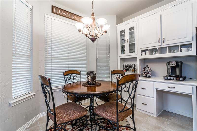 Breakfast nook with butler pantry and desk area built in.