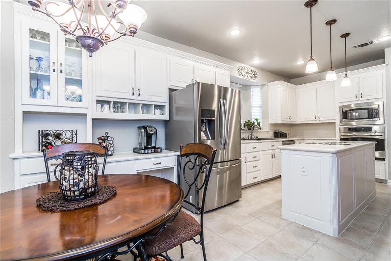 Plenty of storage and cabinets in this kitchen with stainless appliances.