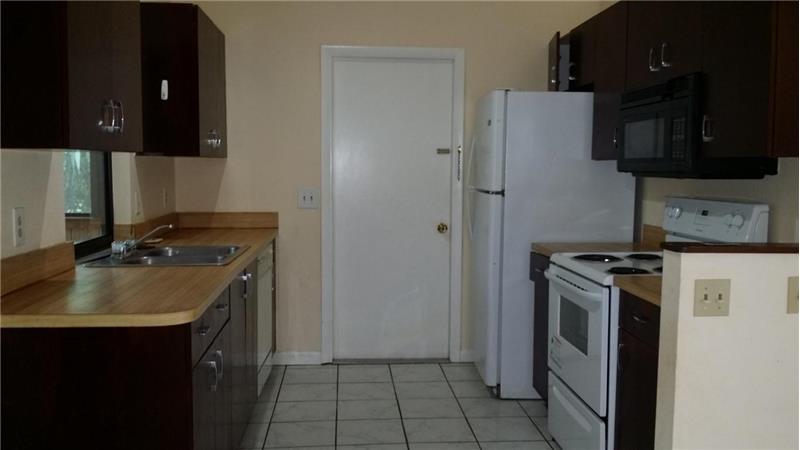 Kitchen With Window overlooking FL Room and Backyard