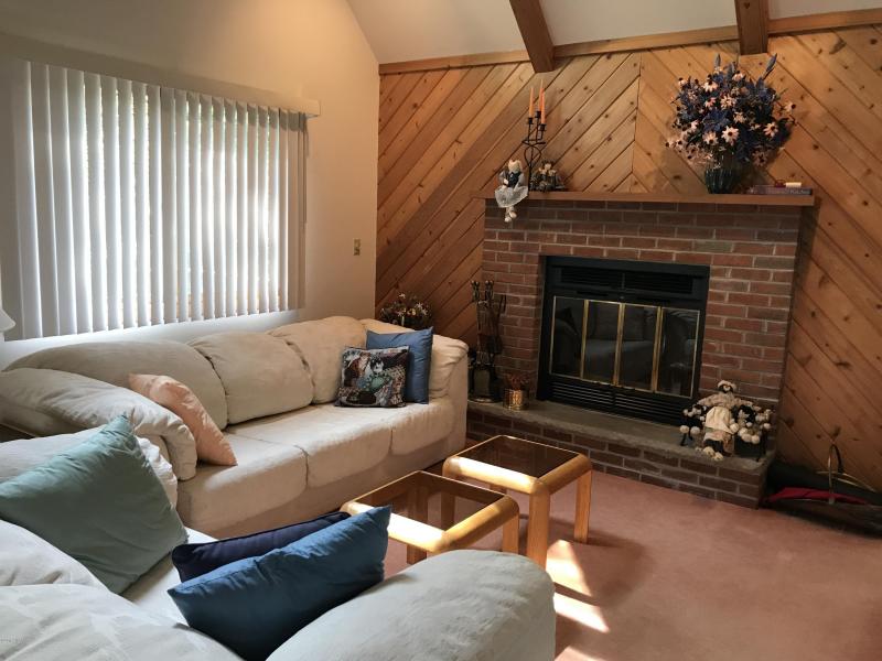 Cozy Fireplace with Tongue and Groove Accent Wall