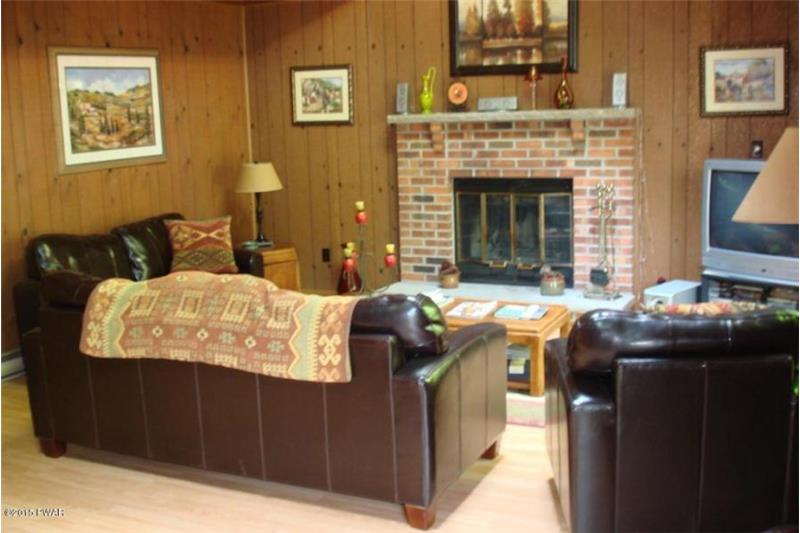 Living Room with Brick Fireplace