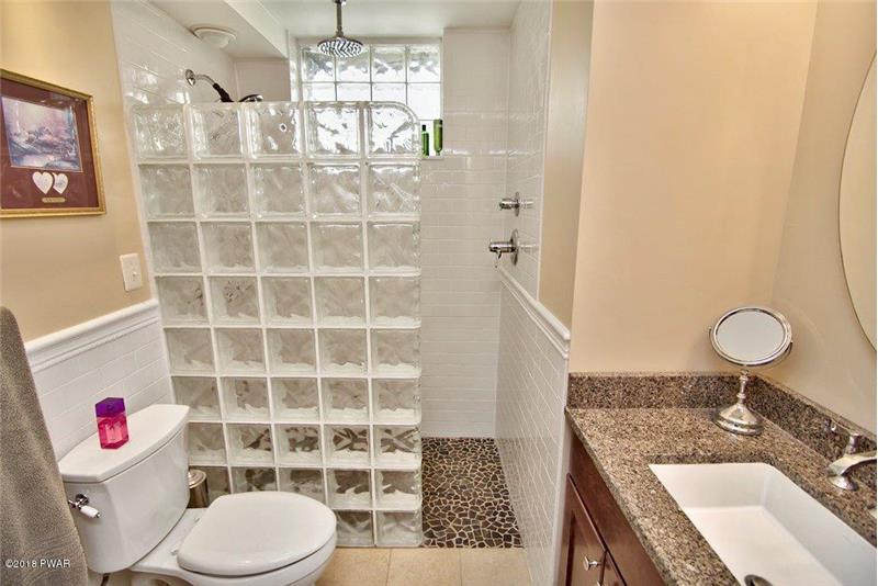 Lower Level Bath with Pebble Floor in Shower