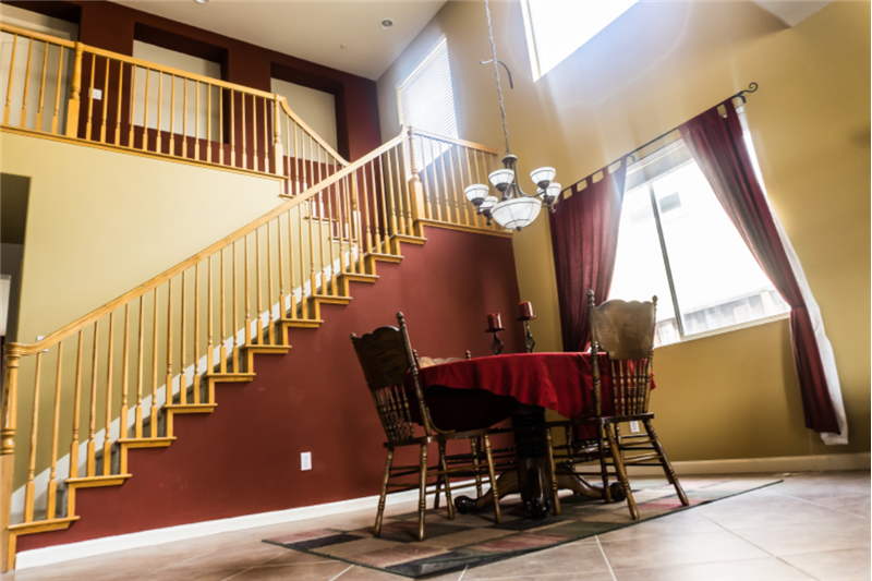 Dining area with bannister to 2nd story