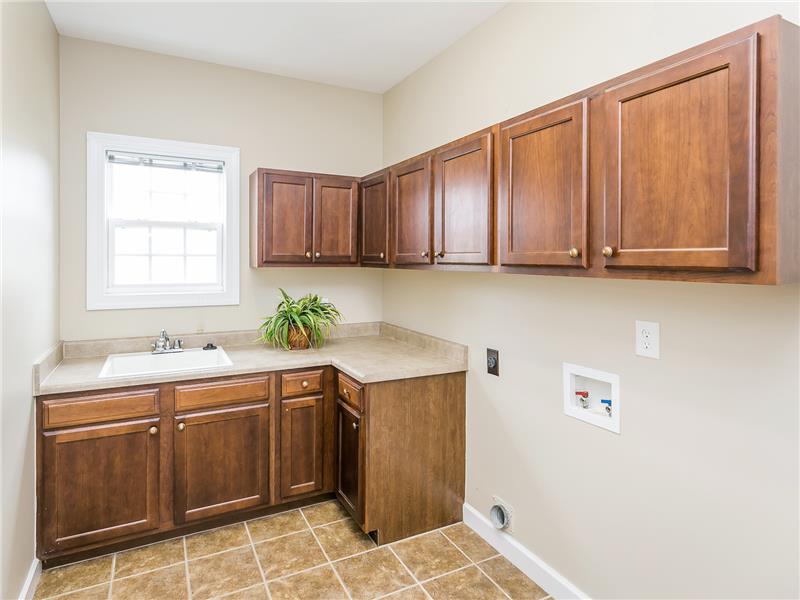 Laundry with Cabinets & A Large Sink
