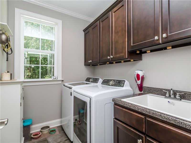LAUNDRY ROOM WITH LARGE SINK AND CABINETS OVER THE SINK!