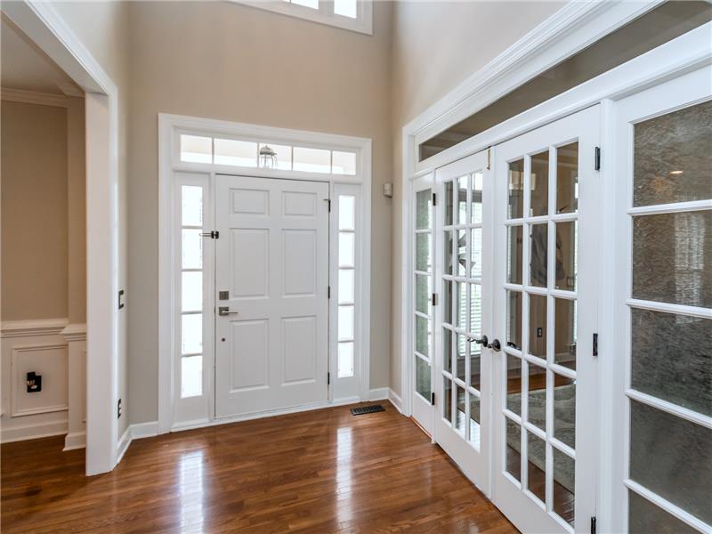 Two Story Foyer With French Doors To First Floor Den / Office