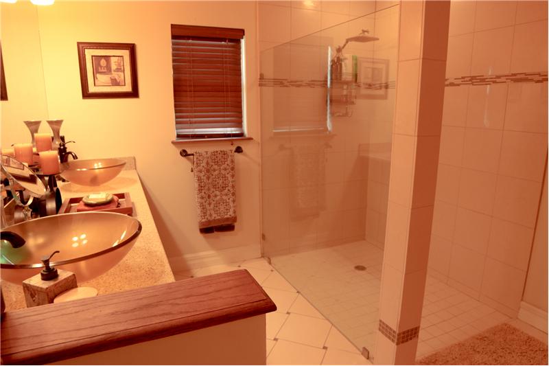 Master bathroom with frameless glass shower