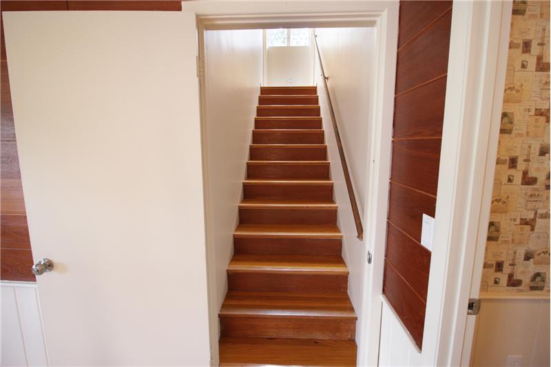 Stairway off entryway foyer
