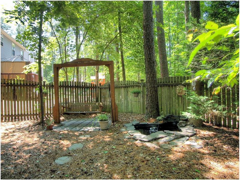 Check out the swing & pond while you relax - Apex NC Real Estate Woodridge Homes for Sale