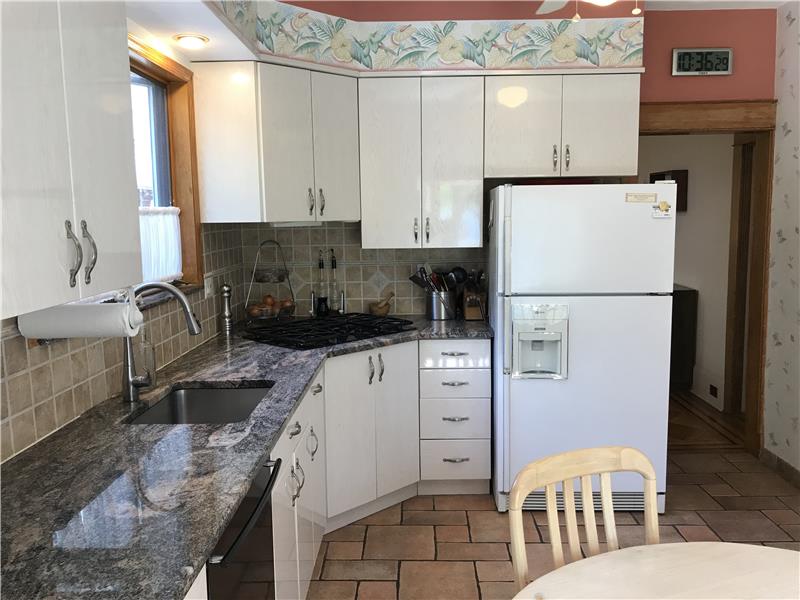 Granite counter top in spacious kitchen.