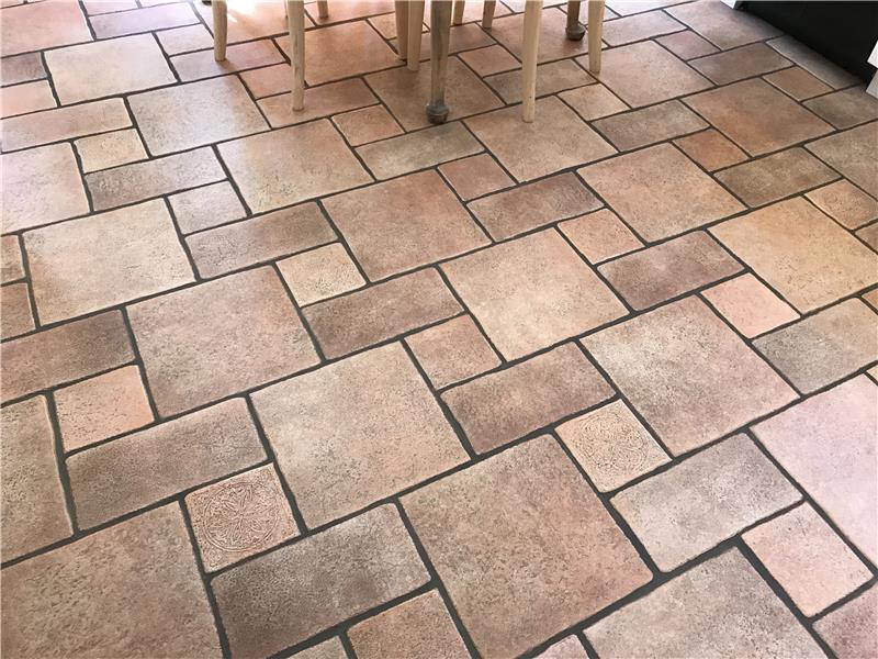 Ceramic tile kitchen floor.