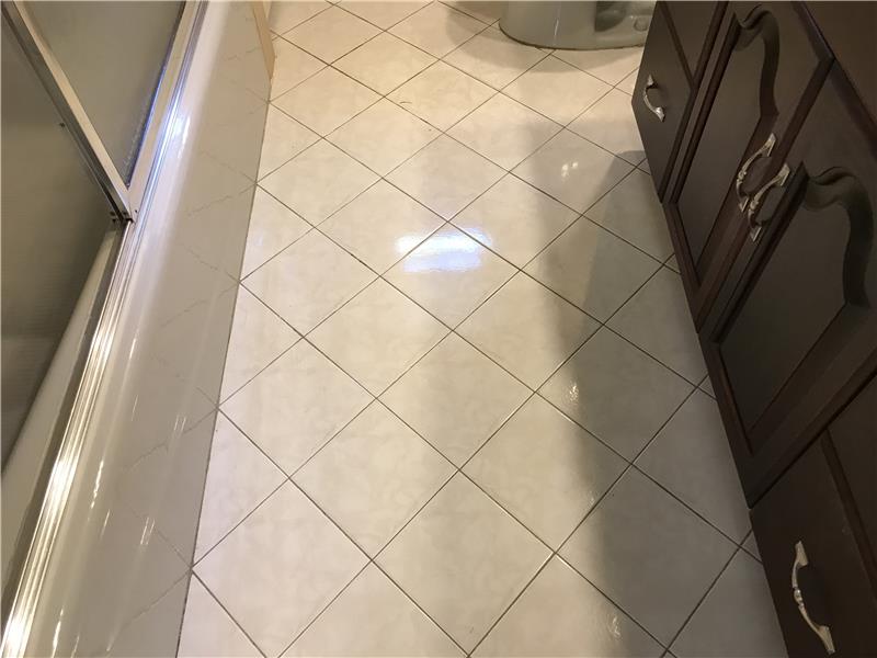 Tile floor First floor full bathroom.