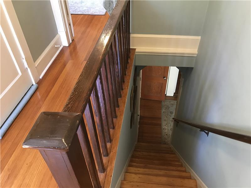 Second floor hallway steps heading downstairs.