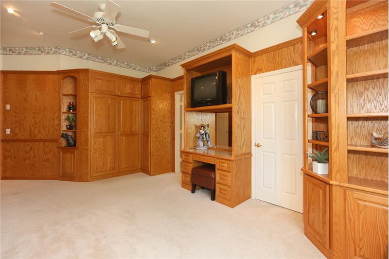 Built-ins are throughout the second bedroom which also has a walk-in closet & en-suite full bath.