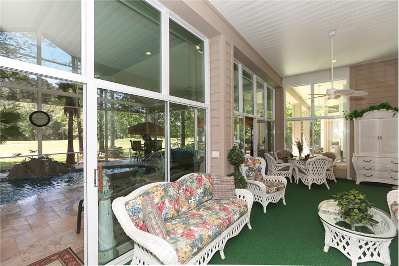 The 13' x 30' Carolina room adds additional casual living space year round with the spellbinding view of the pool, golf course a