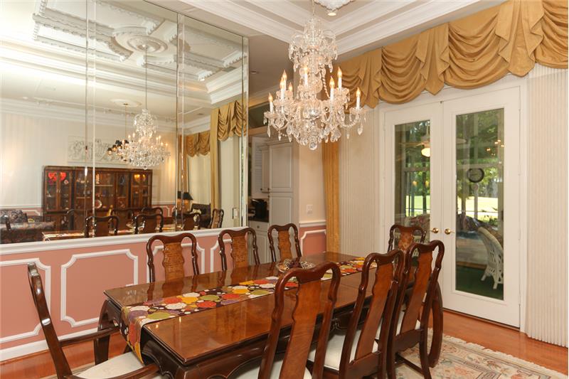 Gorgeous triple beveled mirrors in the dining room give a wonderful effect.