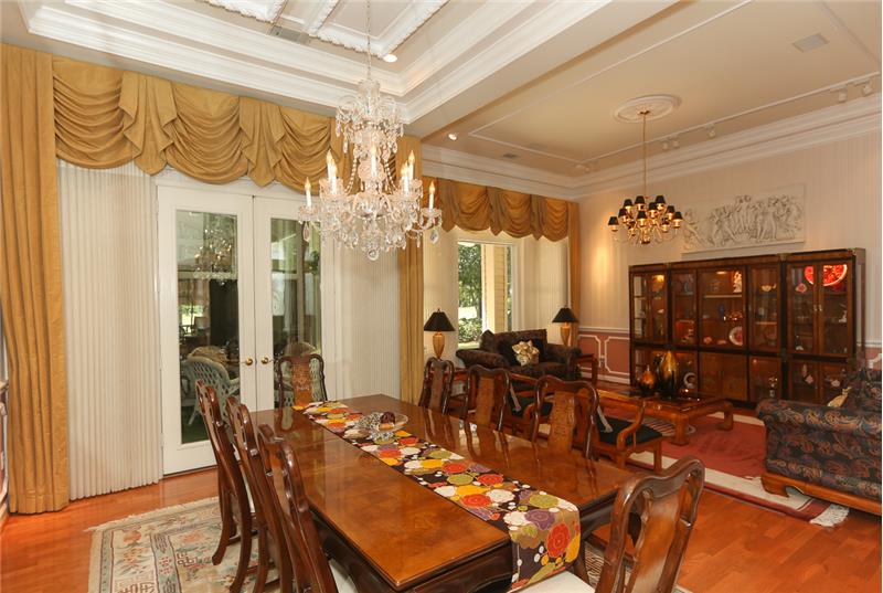 Dining room view of doors to garden room and of the living room