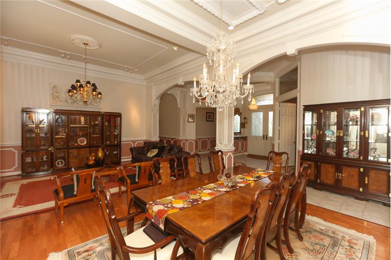 Dining room view of living room and foyer.