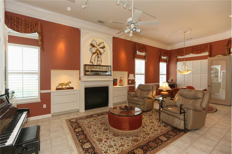 Look at the lovely open floor plan! The gas fireplace & TV make the room beautifully balanced.