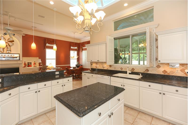 View of the kitchen from the electric glass cooktop area.