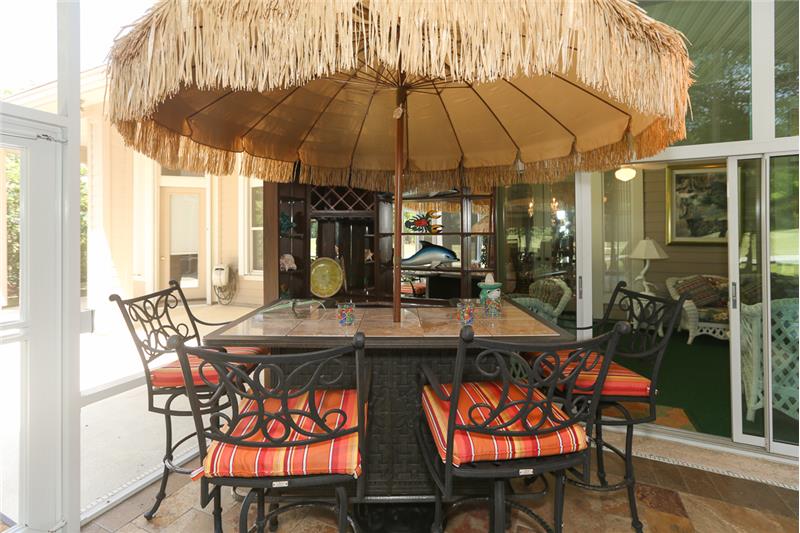 Haven't you always wanted a Tiki bar--this one will stay with the home!  Mirrored bar cabinet for storage as well as the umbrell