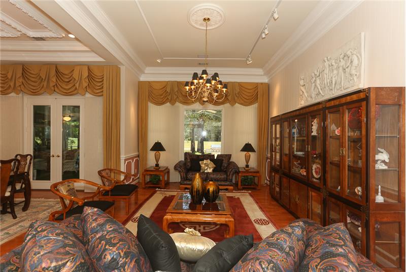 Magnificent living room with views of the golf course.