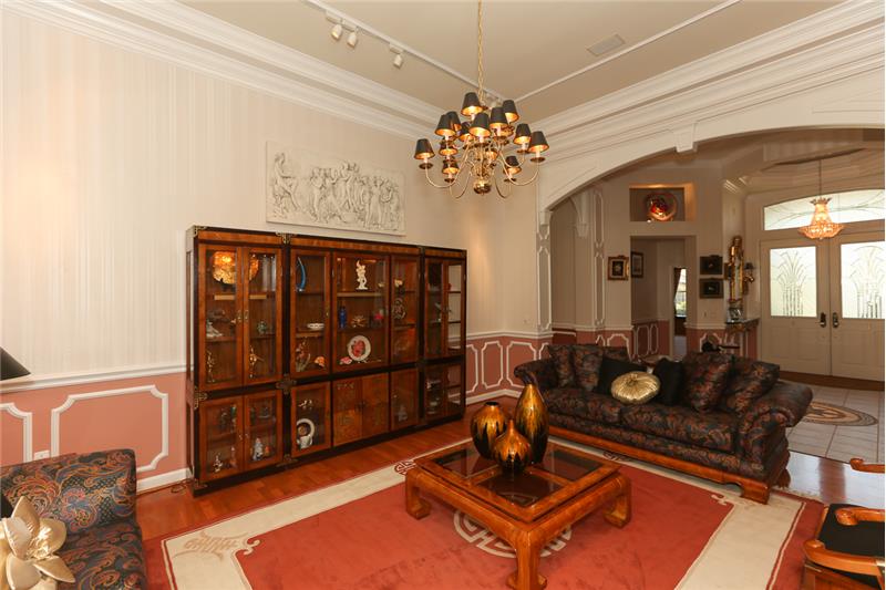 Living room with a view of the foyer.
