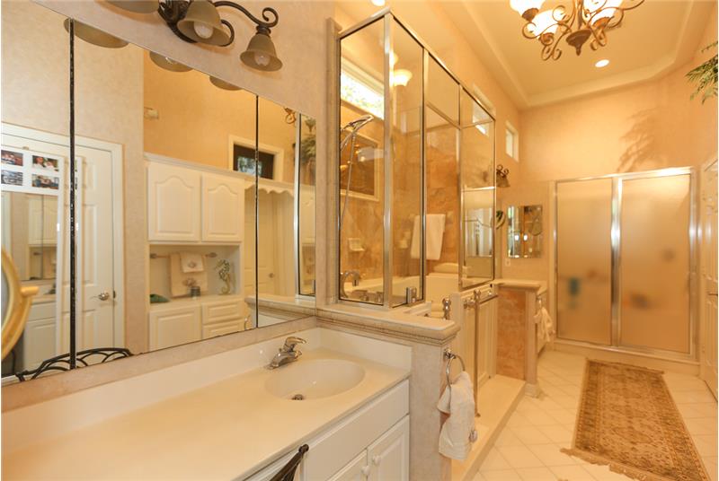 The Owner's suite offers dual sinks, a Jacuzzi, Italian marble wall with golden Egret inlaid tile, upgraded lighting and chandel